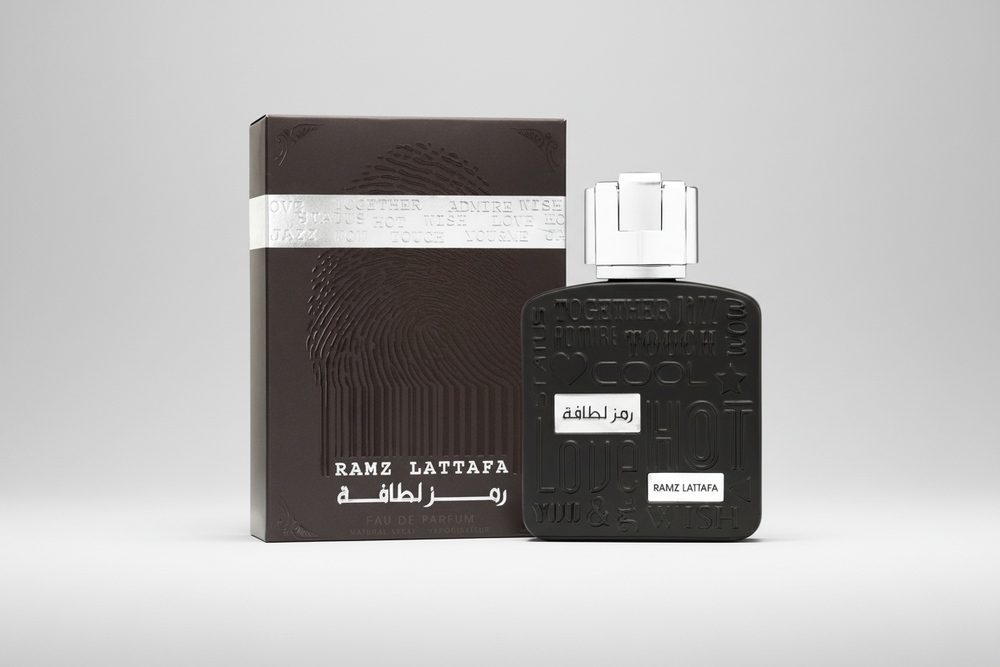 Lattafa Ramz Silver EDP 100ml perfume bottle and box – elegant fresh citrus woody fragrance with top notes grapefruit pineapple lemon, heart of lavender cedarwood patchouli, base of amber tonka bean musk vanilla