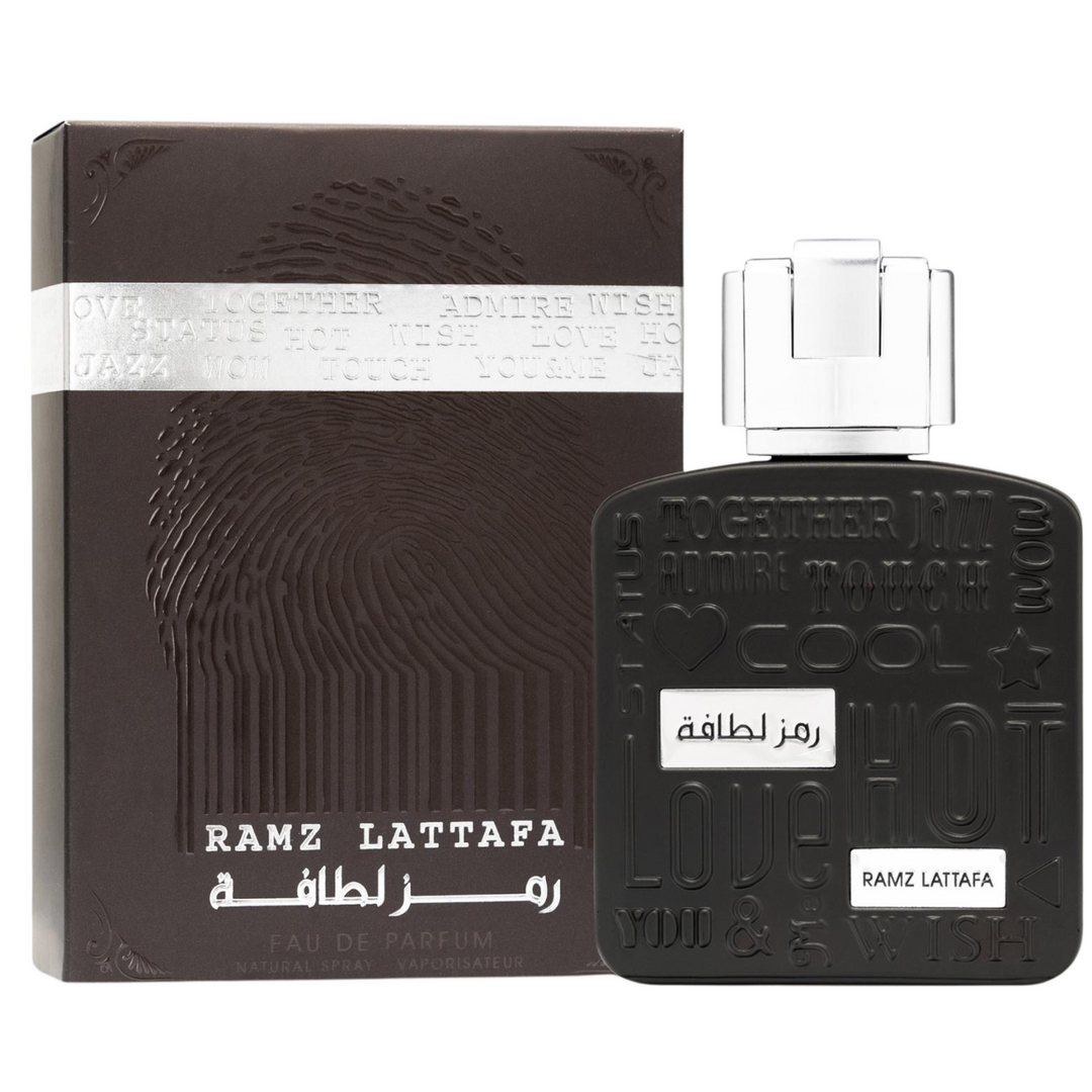 Lattafa Ramz Silver EDP 100ml perfume bottle and box – elegant fresh citrus woody fragrance with top notes grapefruit pineapple lemon, heart of lavender cedarwood patchouli, base of amber tonka bean musk vanilla