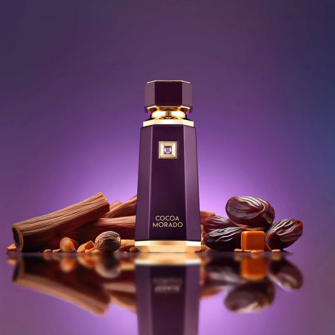 French Avenue Cocoa Morado EDP 100ml perfume bottle straight front view on purple background surrounded by pieces of dates cinnamon and caramel – luxurious sweet gourmand fragrance with cocoa caramel cinnamon, dates praline jasmine, vanilla amber sandalwood musk