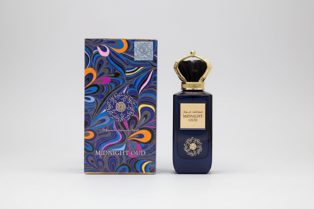 Perfume bottle and packaging of Ard al zaafaran 'Midnight Oud' with intricate design on a white background