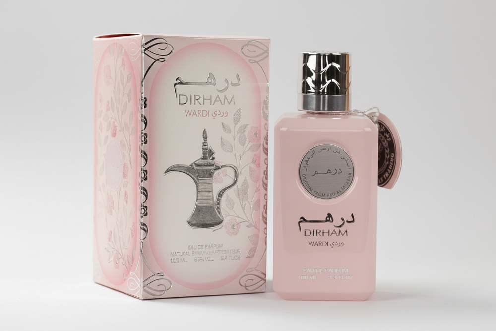 Pink perfume bottle and packaging with Ard Al Zaafaran Dirham Wardi  branding on a white background