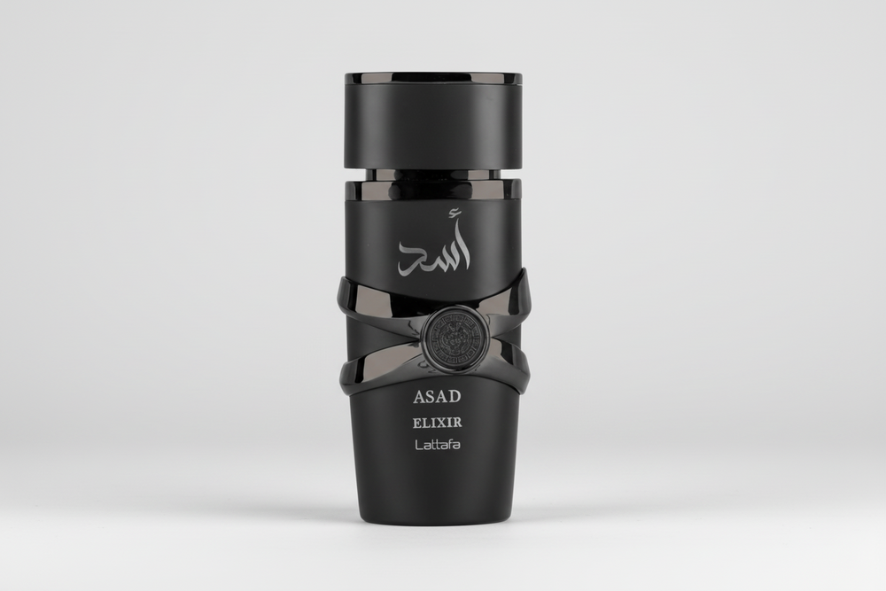 Black perfume bottle labeled 'Asad Elixir' on a white background