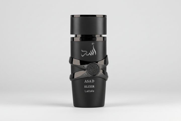 Black perfume bottle labeled 'Asad Elixir' on a white background