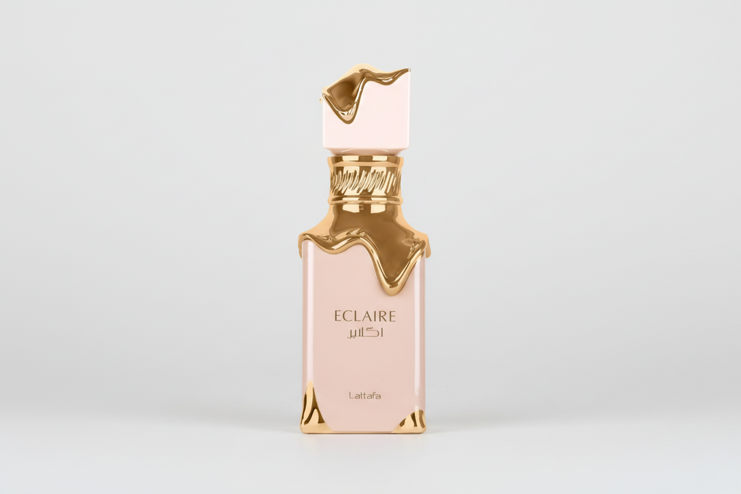 Perfume bottle labeled 'Eclaire' with gold accents on a white background