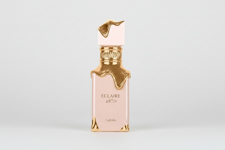 Perfume bottle labeled 'Eclaire' with gold accents on a white background