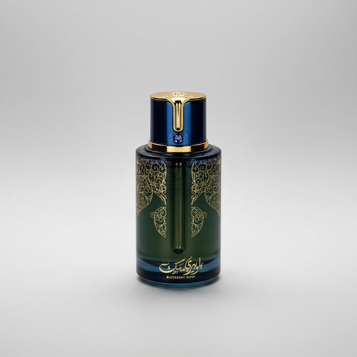 Perfume bottle with intricate designs on a white background