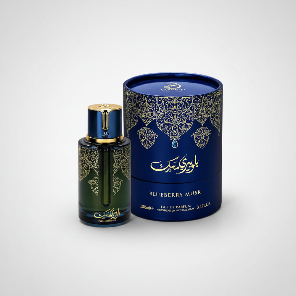 Perfume bottle and packaging with intricate designs on a white background