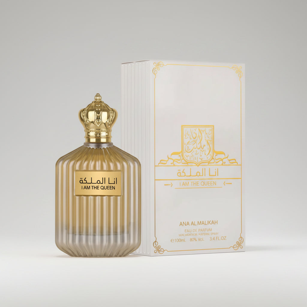 Perfume bottle and packaging of 'I Am The Queen' with gold accents on a white background