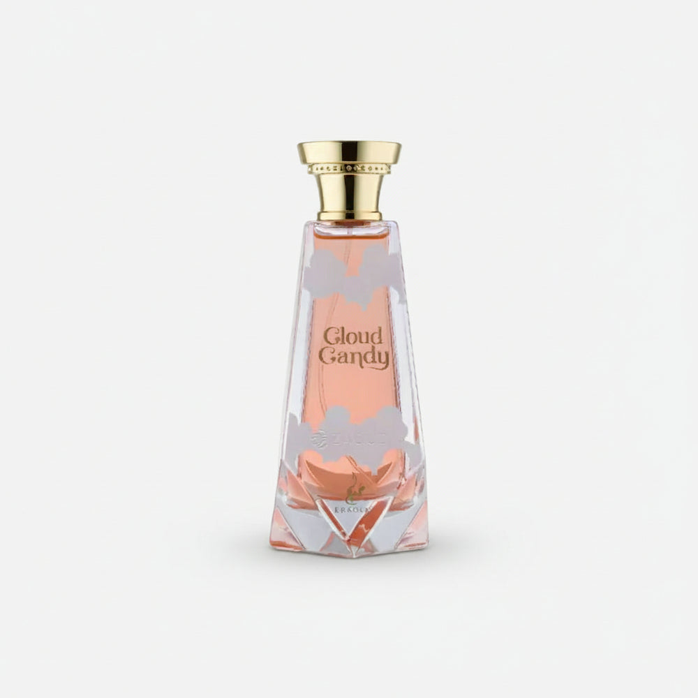 A faceted glass perfume bottle filled with pink liquid, featuring a gold cap and the text 'Cloud Candy' on the front, set against a plain white background.