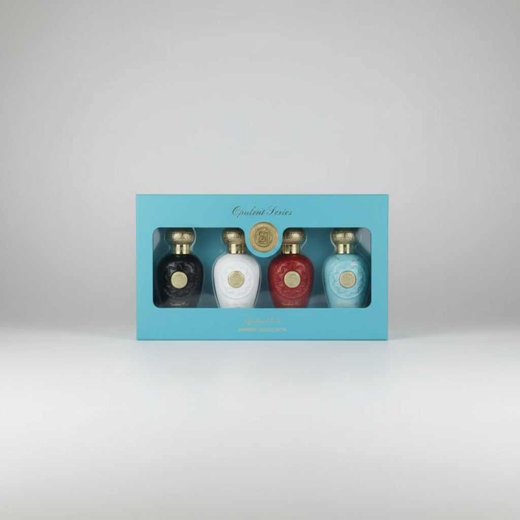 Set of four perfume bottles in white, black, blue, and red with gold caps and labels on a white background.