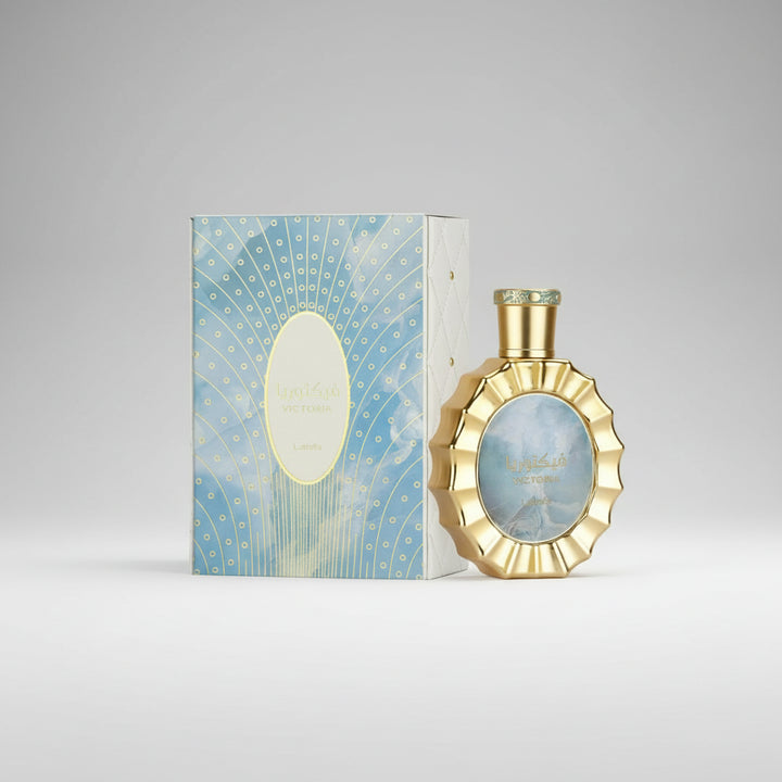 Gold perfume bottle with matching box on a white background