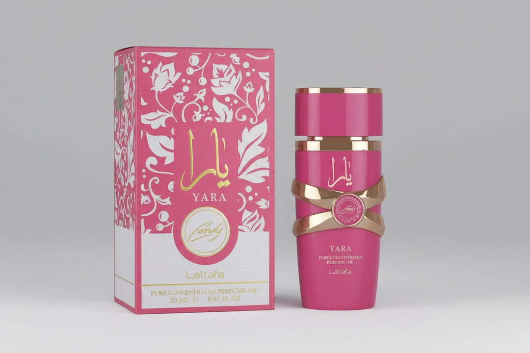 Pink Yara perfume bottle and packaging with gold accents on a white background